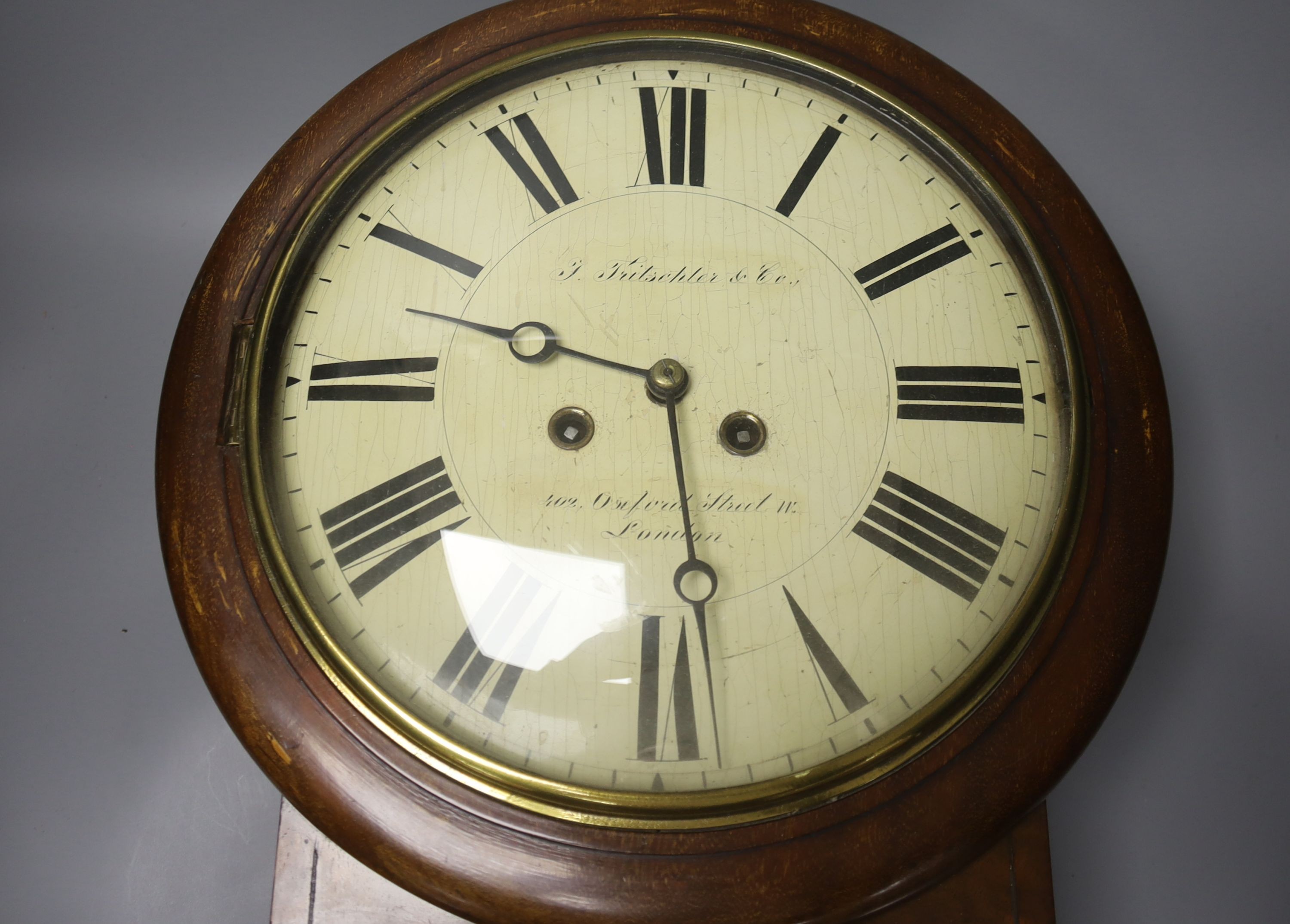 A 19th century mahogany cased 8 day drop dial wall clock, painted wood convex dial, F. Fritschler & co., 54cm